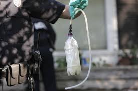 Officer holding up shake & bake meth